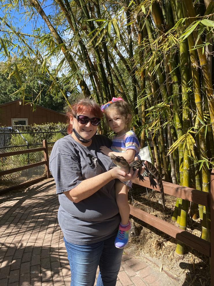 Holding a baby gator